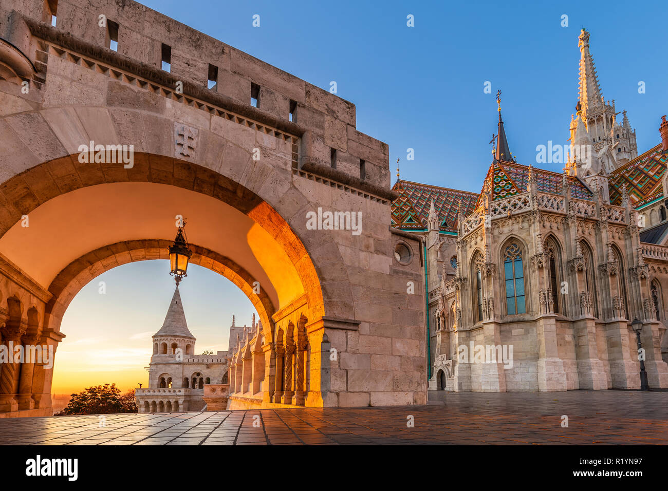 Budapest, Hungary - Entrance of Buda District with the beautiful Matthias Church at golden sunrise and clear blue sky Stock Photo