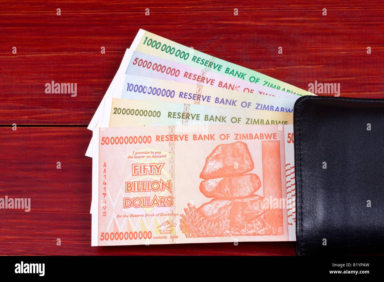 Zimbabwean dollars in the black wallet Stock Photo