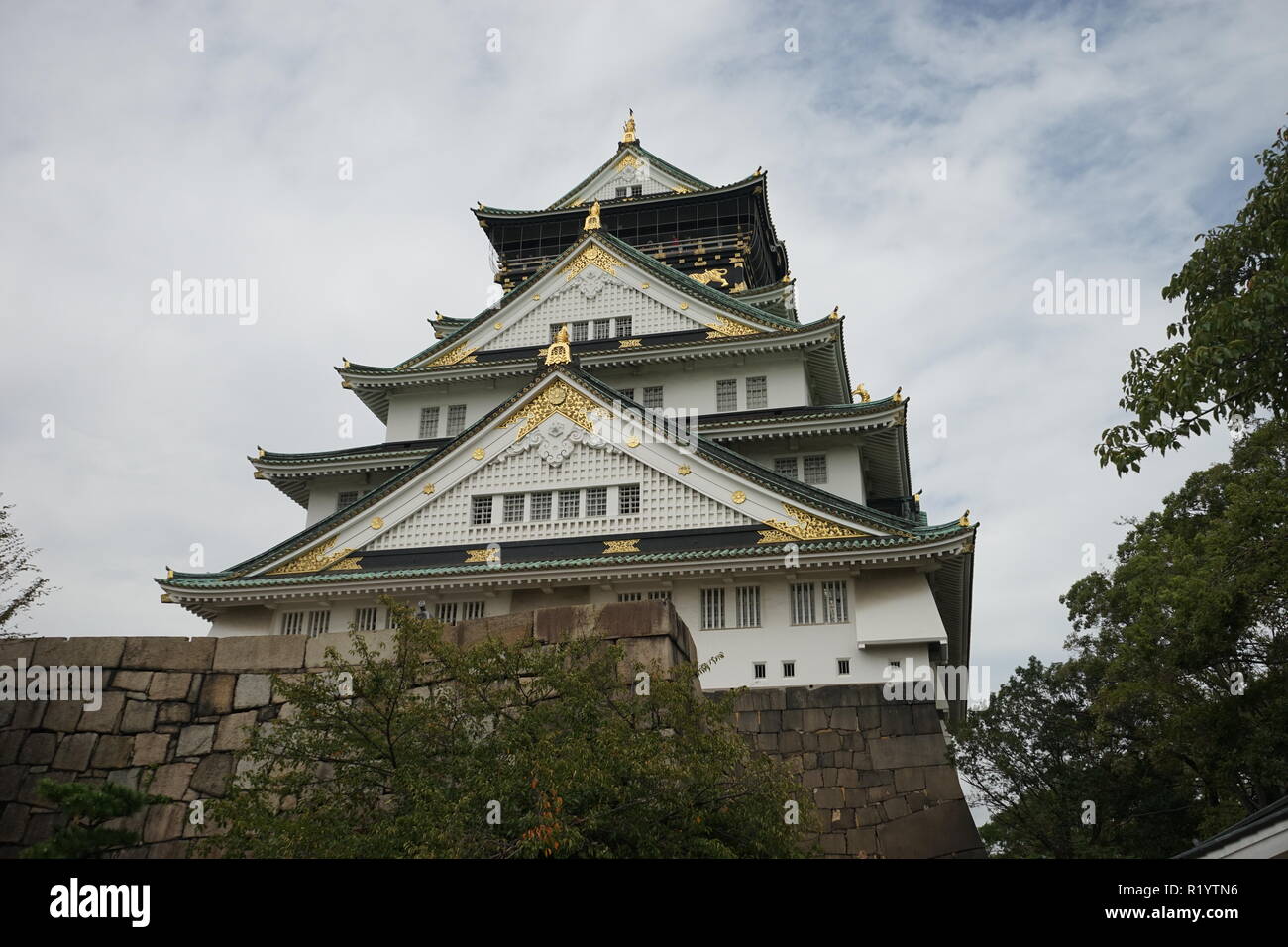 Osaka Castle is one of Japan's most famous landmarks and it played a major role in the unification of Japan during the 16th century. Stock Photo