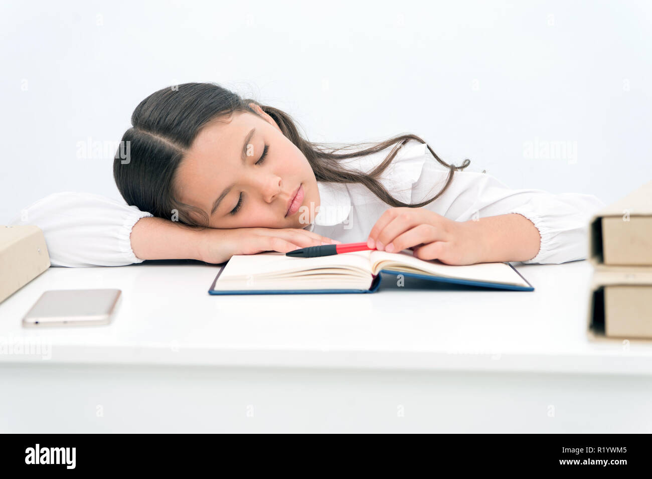 Nap concept. Tired schoolgirl have nap. Little girl taking nap at desk
