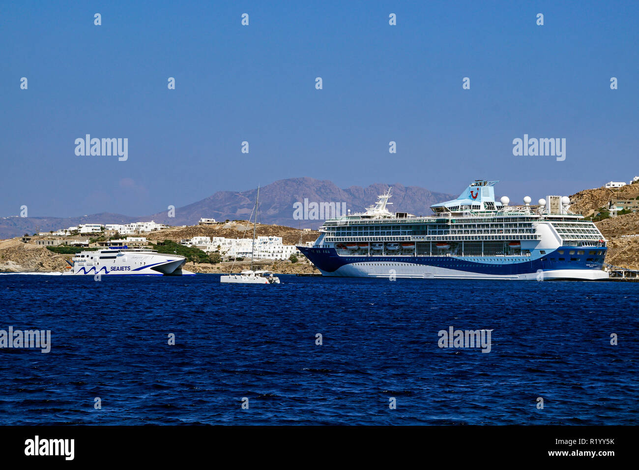 Marella Cruises cruise liner Marella Discovery 2 in harbour Mykonos town island Mykonos Cyclades group Aegean Sea Greece with Seajets Champion Jet 1 Stock Photo