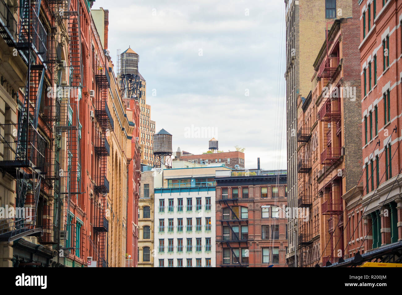 Close-up view of New York City style apartment buildings with emergency stairs along Mott Street in the Chinatown neighborhood of Manhattan NYC. Stock Photo