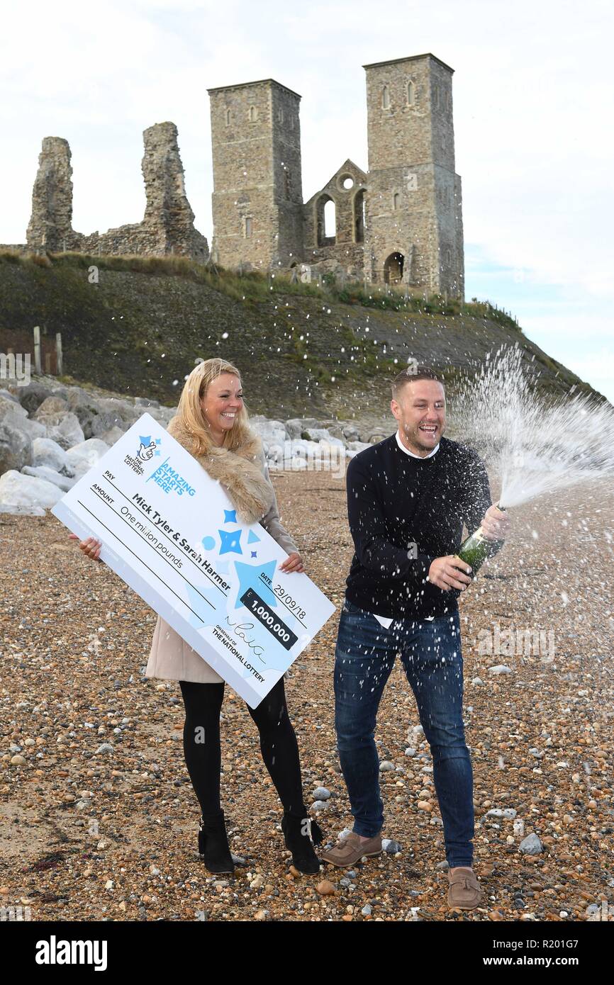 Mick Tyler, 35, and his fiancee Sarah Harmer, 33, winners of the One Million Pound Lotto Raffle, pictured on the beach where Mick proposed to Sarah last Christmas Eve, at Reculver in Kent.  Featuring: Mick Tyler, Sarah Harmer Where: Reculver, Kent, United Kingdom When: 12 Oct 2018 Credit: Steve Finn/WENN Stock Photo