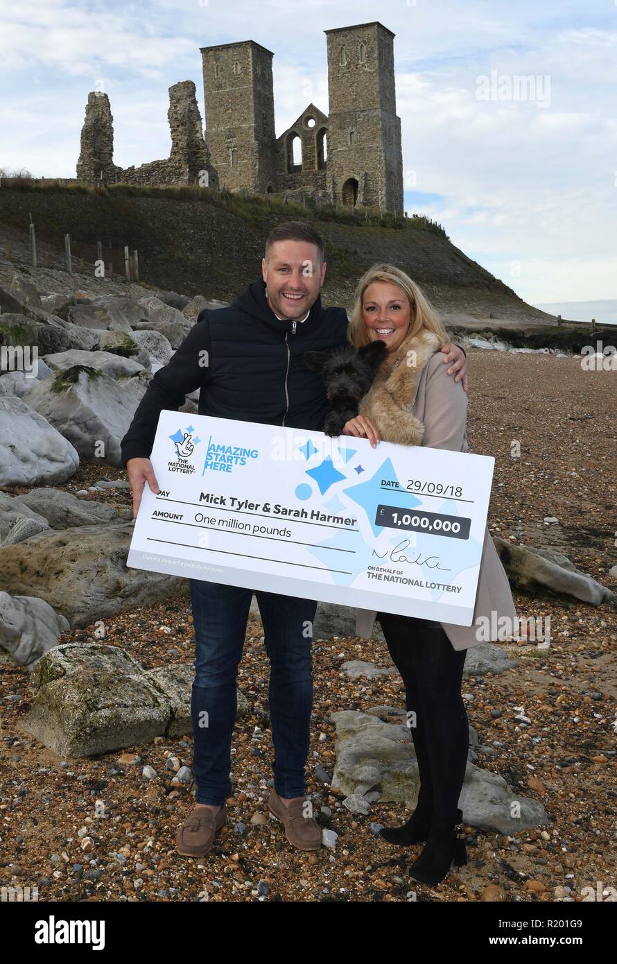 Mick Tyler, 35, and his fiancee Sarah Harmer, 33, winners of the One Million Pound Lotto Raffle, pictured on the beach where Mick proposed to Sarah last Christmas Eve, at Reculver in Kent.  Featuring: Mick Tyler, Sarah Harmer Where: Reculver, Kent, United Kingdom When: 12 Oct 2018 Credit: Steve Finn/WENN Stock Photo
