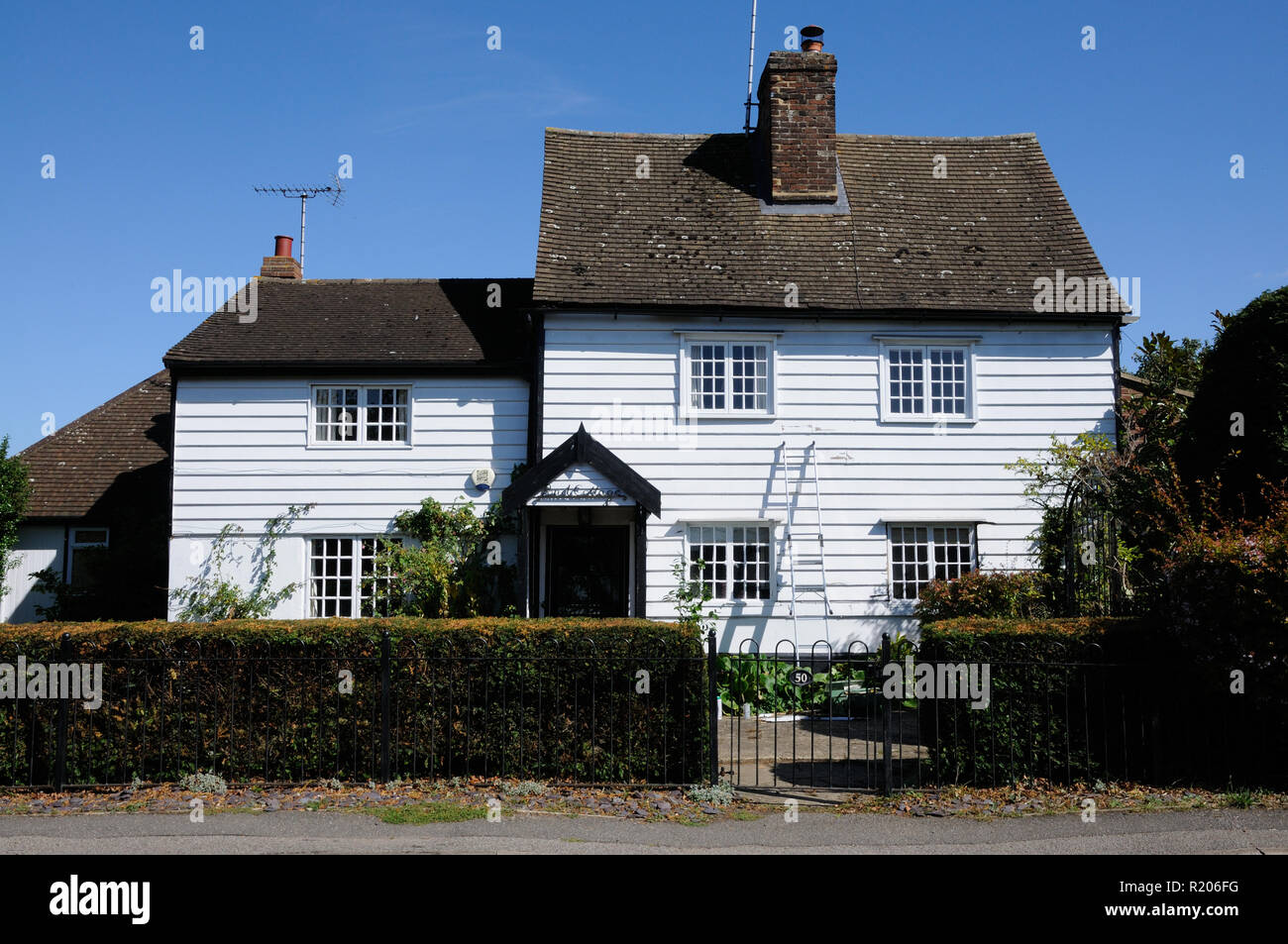 Pond Cottage, Essendon, Hertfordshire, is a white weather boarded