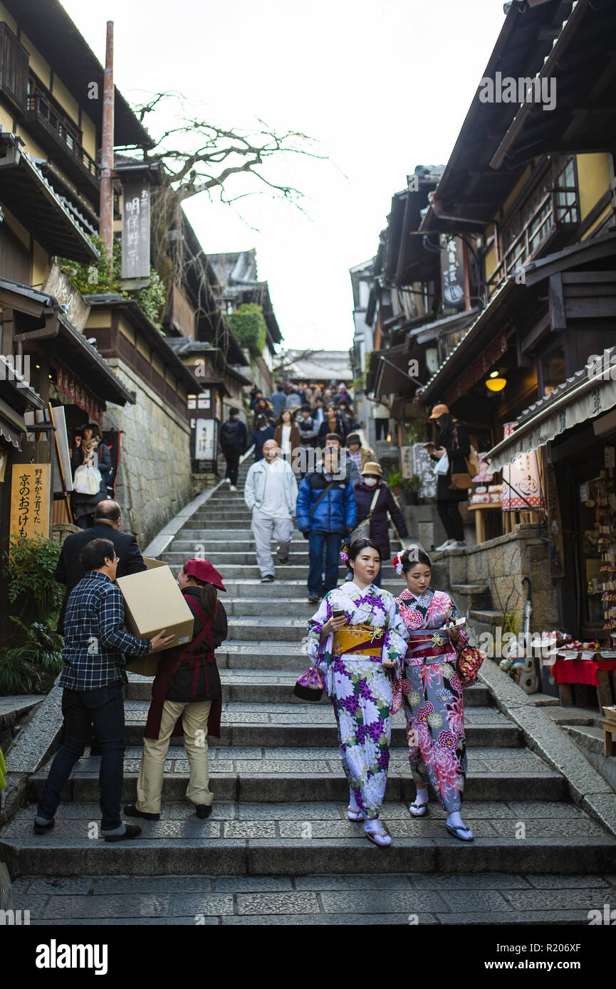 KYOTO, JAPAN - 10 JANUARY 2016 : Japanese women in traditional Kimono are walking on the way to Kiyomizu-Dera temple in Kyoto. Stock Photo