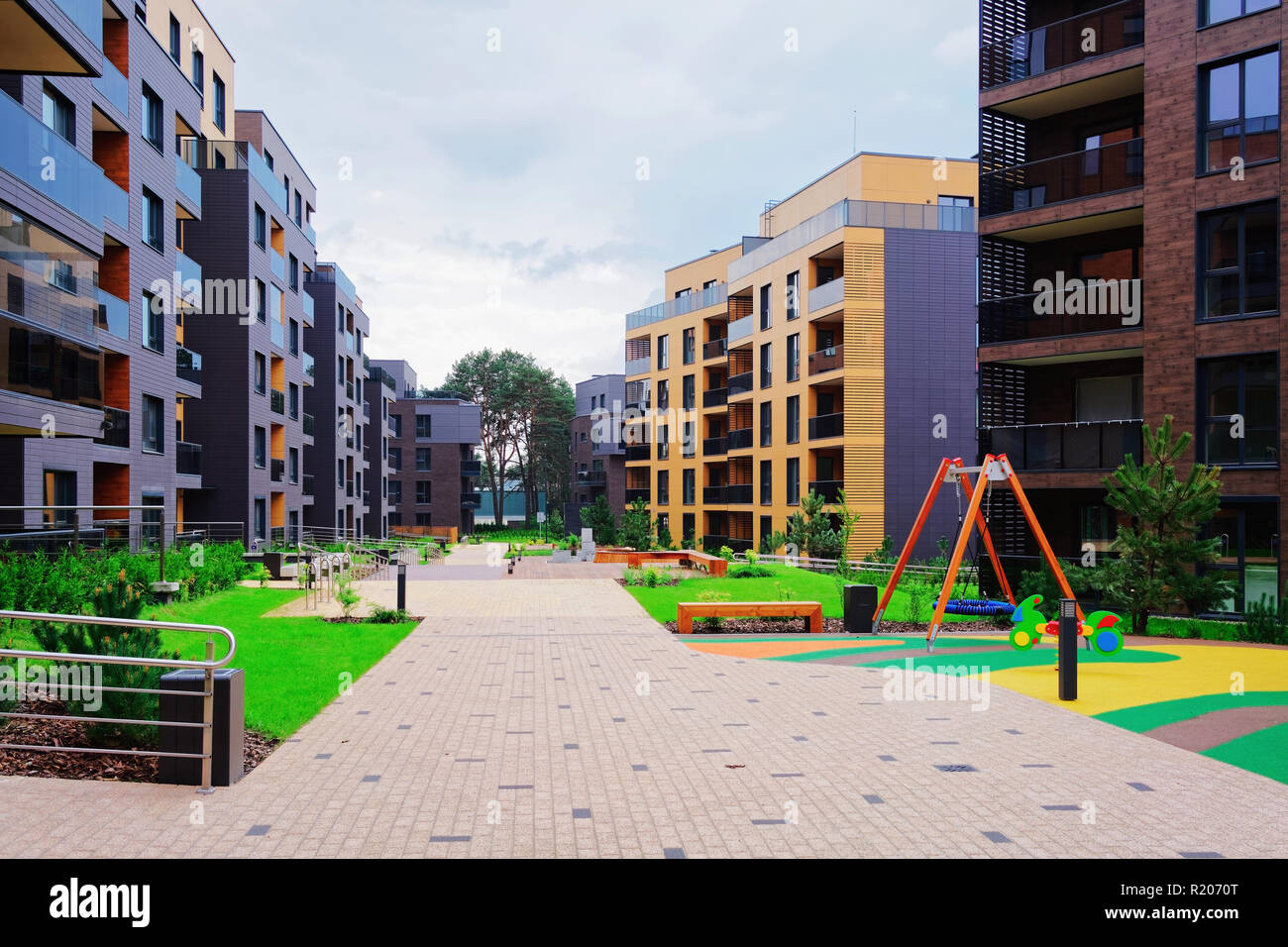 Children playground with European modern complex of apartment ...