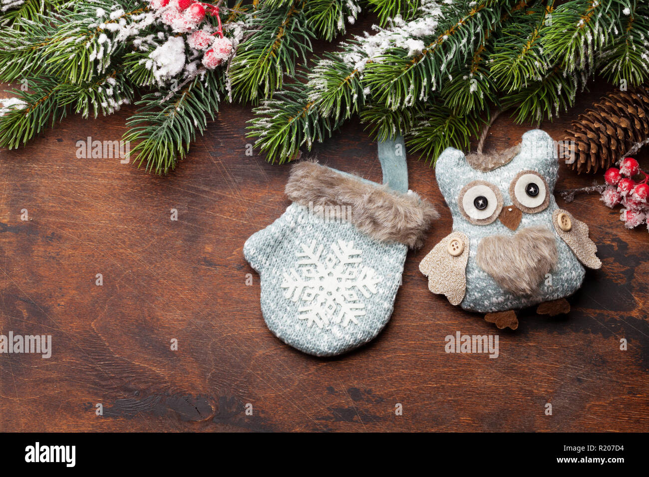 Christmas greeting card with decor and fir tree branch covered by snow ...