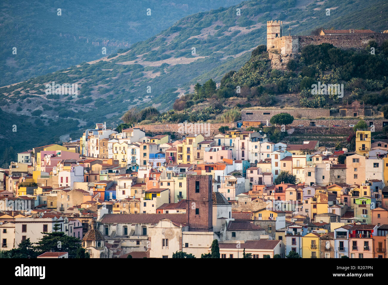 The beautiful village of Bosa with colored houses and a medieval castle on the top of the hill. Bosa is located in the north-west of Sardinia, Italy. Stock Photo