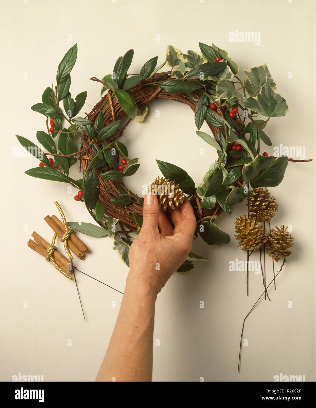 Step x step Making fresh foliage Christmas wreath Stock Photo Alamy