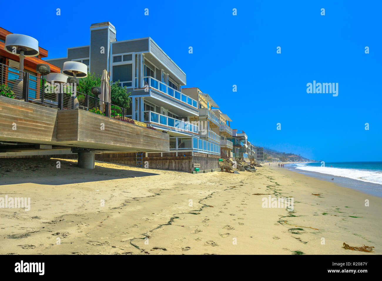 California West Coast. Malibu beach houses on popular Carbon Beach also called Billionaire Beach for the many houses of famous people. Malibu shoreline landscape in a summers sunny day. Stock Photo