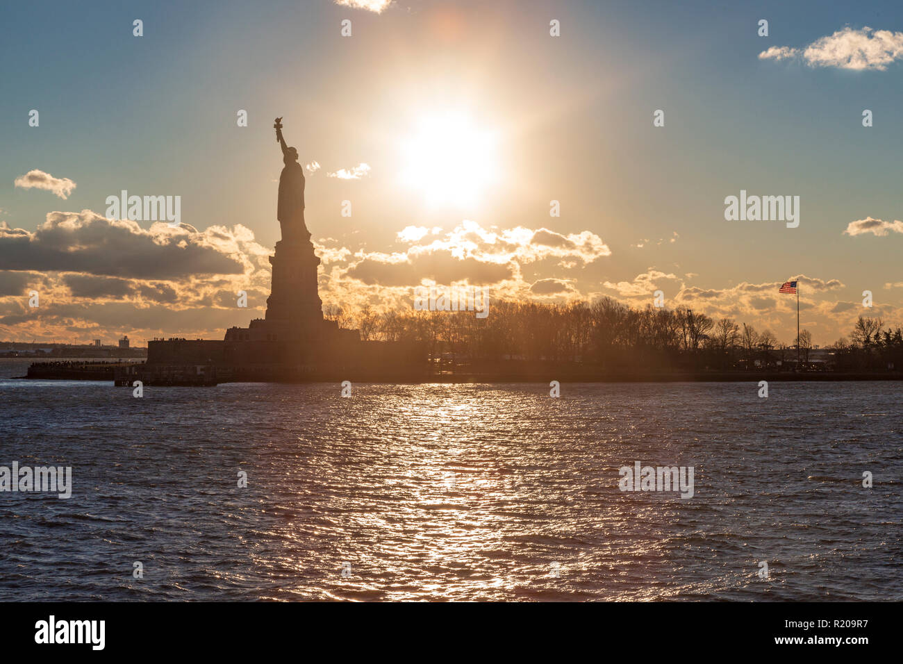 Statue of liberty silhouette during sunset in New York, NY, USA Stock ...