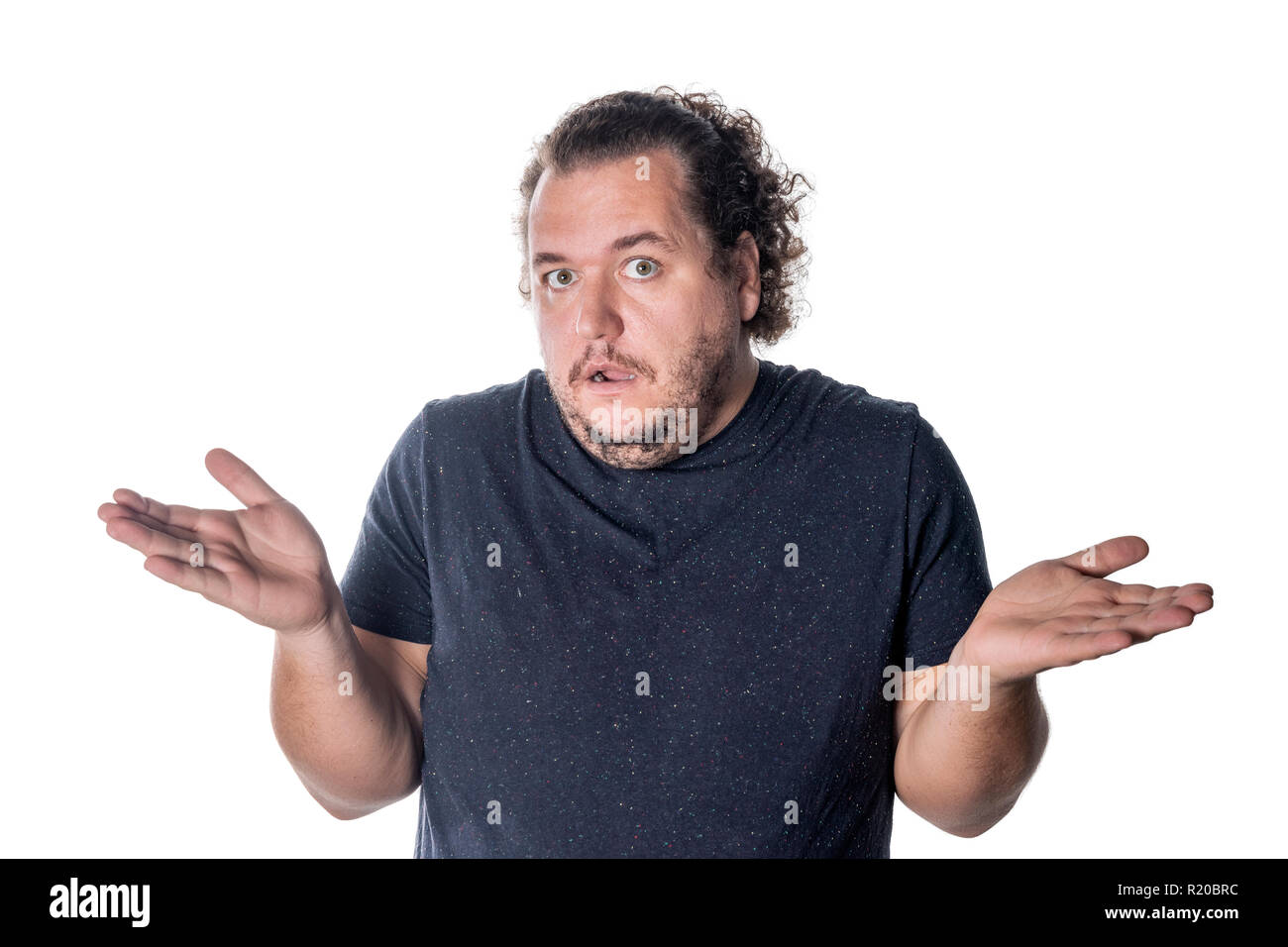 Surprised man throws up his hands in disbelief Stock Photo Alamy