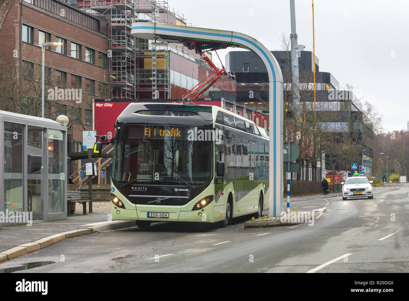 GOTHENBURG, SWEDEN - NOVEMBER 14 2018: Electric public transport passenger bus charging at charging station Stock Photo