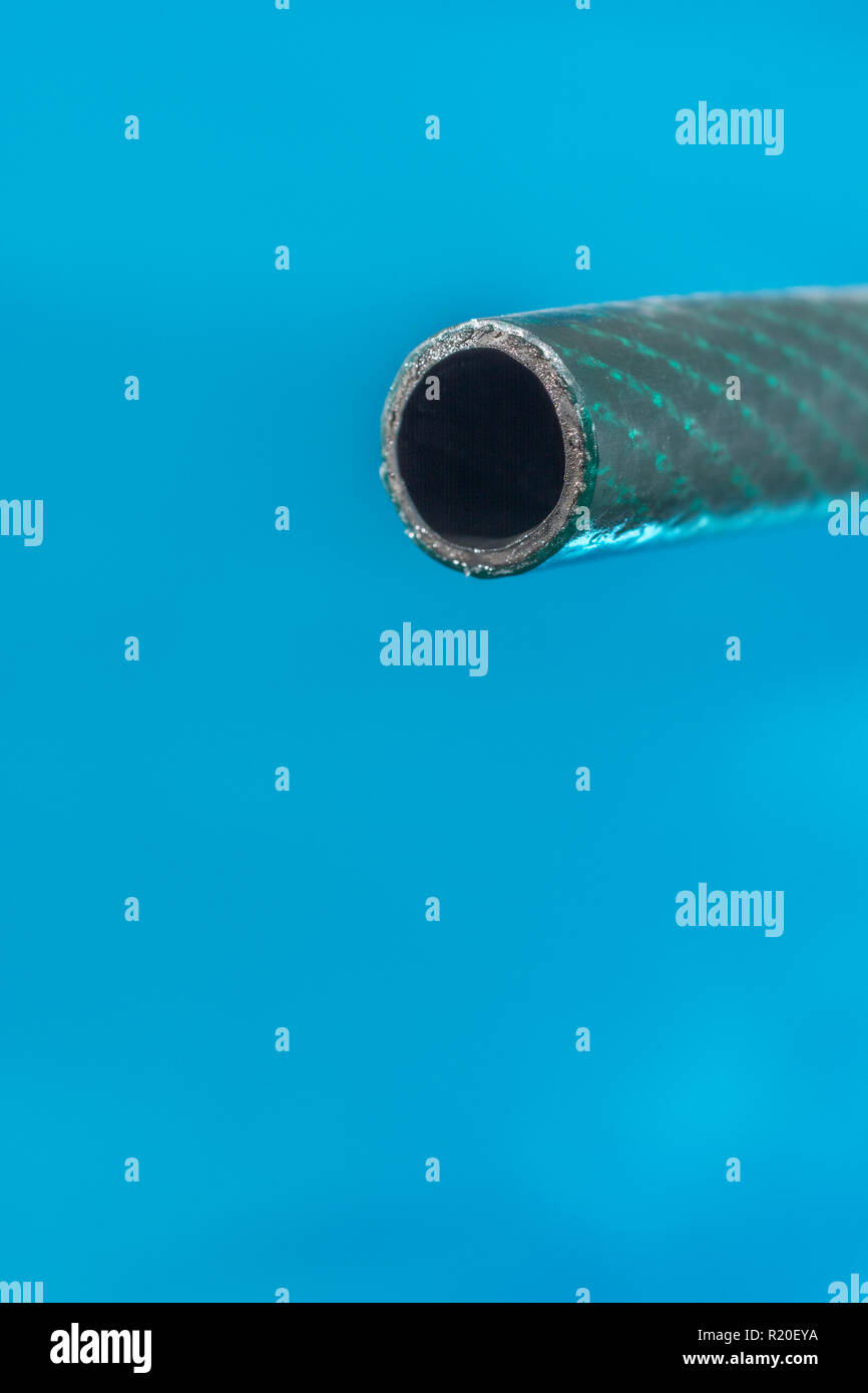 Plastic garden hosepipe / PVC hose pipe with last water drop against