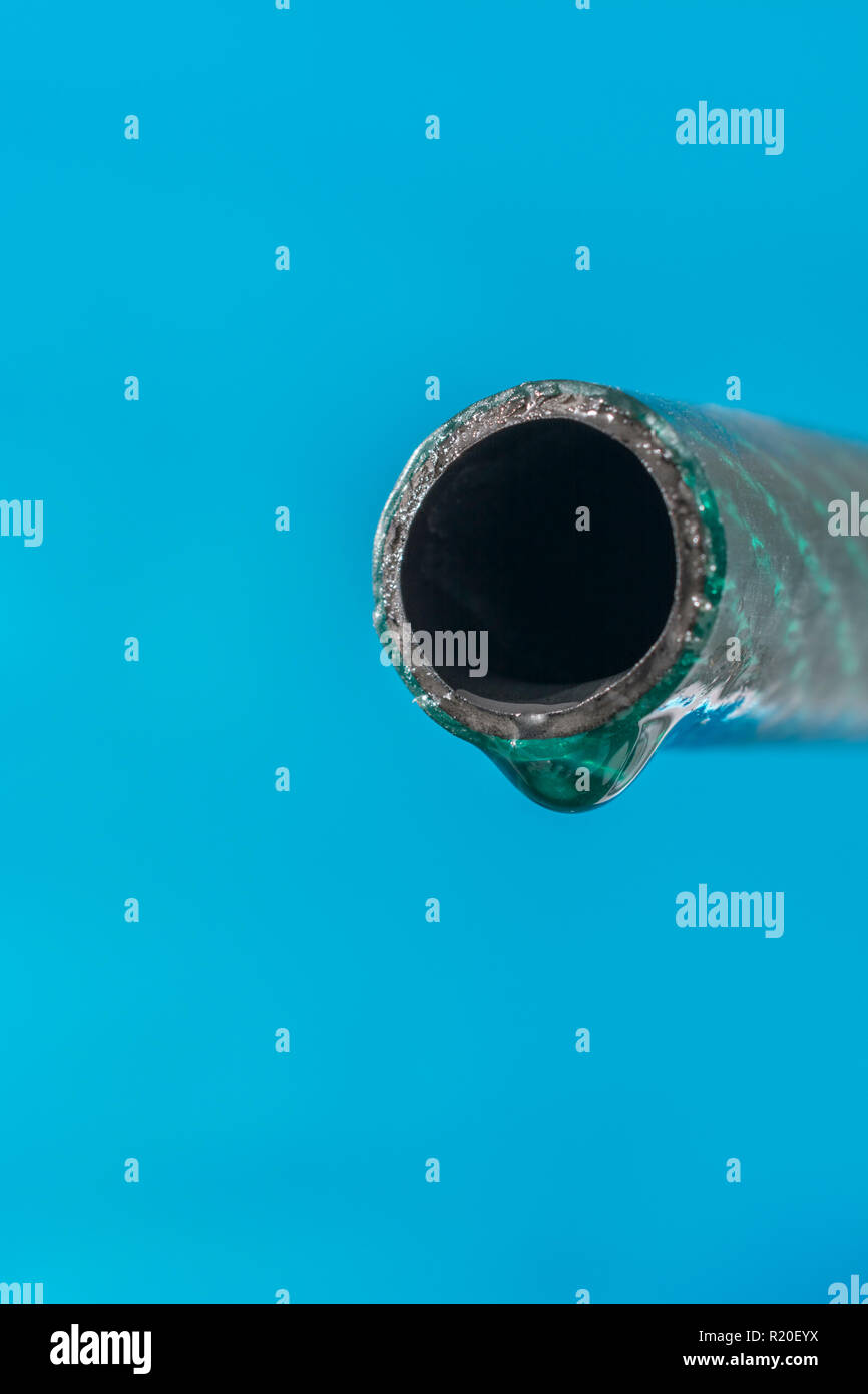 Plastic garden hosepipe / PVC hose pipe with last water drop against