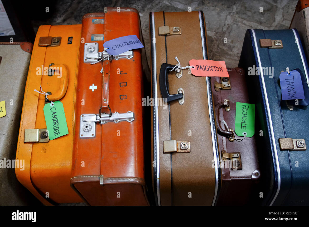 Vintage suitcases with vintage luggage tags. Stock Photo