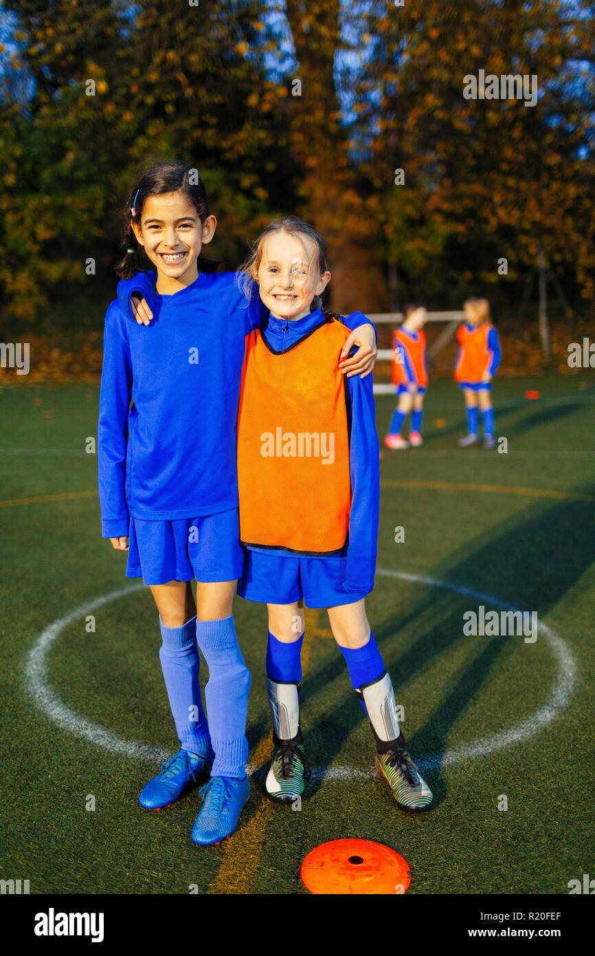 Portrait smiling, confident girl soccer players Stock Photo