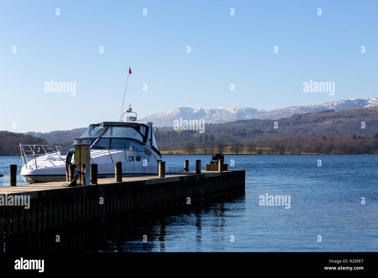 Grasmere/England - February 25th 2018: Yacht on the Lake District in Northern England on sunny winters day Stock Photo