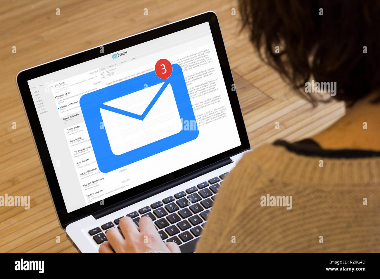 mail concept: receiving email on a laptop screen. Screen graphics are made up. Stock Photo