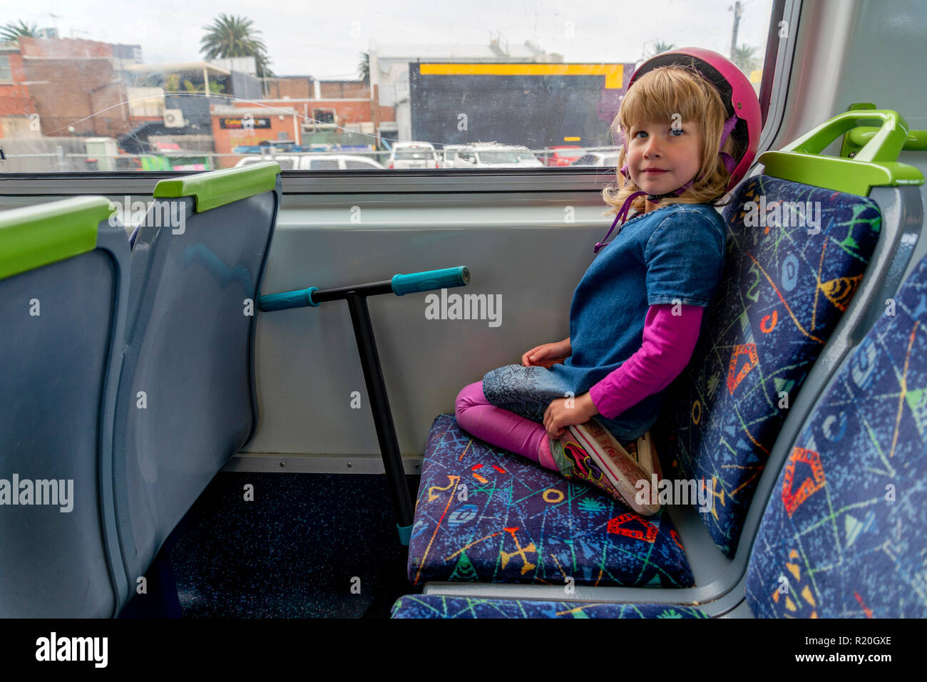 Young girl with a scooter on train Stock Photo Alamy