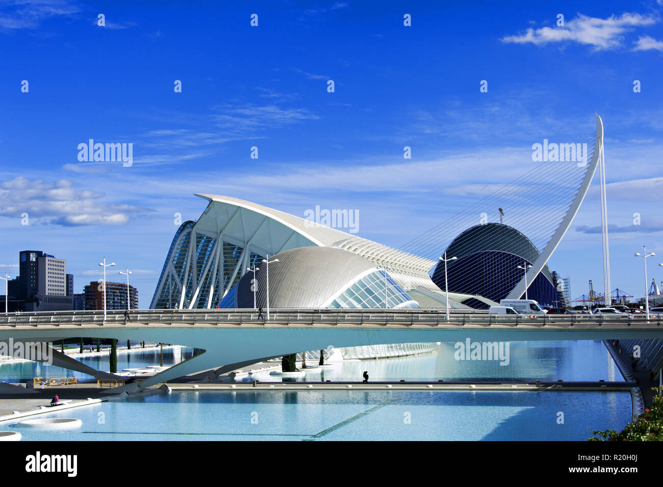 A long bridge carries the city traffic across the centre of The City of Arts and Sciences, in the background. Valencia, Spain. Stock Photo