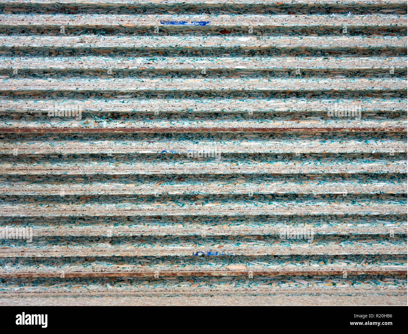 Background of the ends of the laminated grooved chipboard Stock Photo