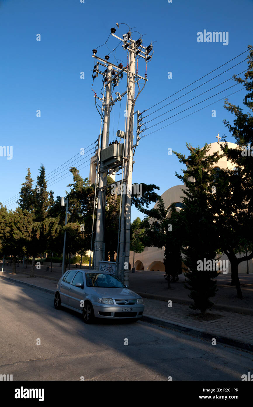 electricity pylon in the street vouliagmeni athens greece Stock Photo