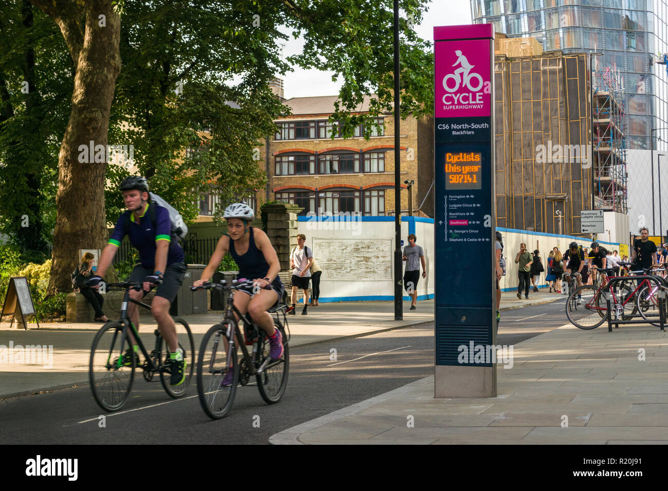 Cyclists cycling on a section of the CS6 North-South Cycle Superhighway at afternoon rush hour, Blackfriars, London, UK Stock Photo