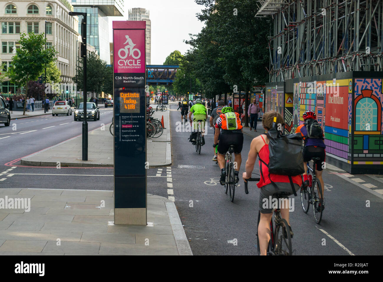 Cyclists cycling on a section of the CS6 North-South Cycle Superhighway at afternoon rush hour, Blackfriars, London, UK Stock Photo