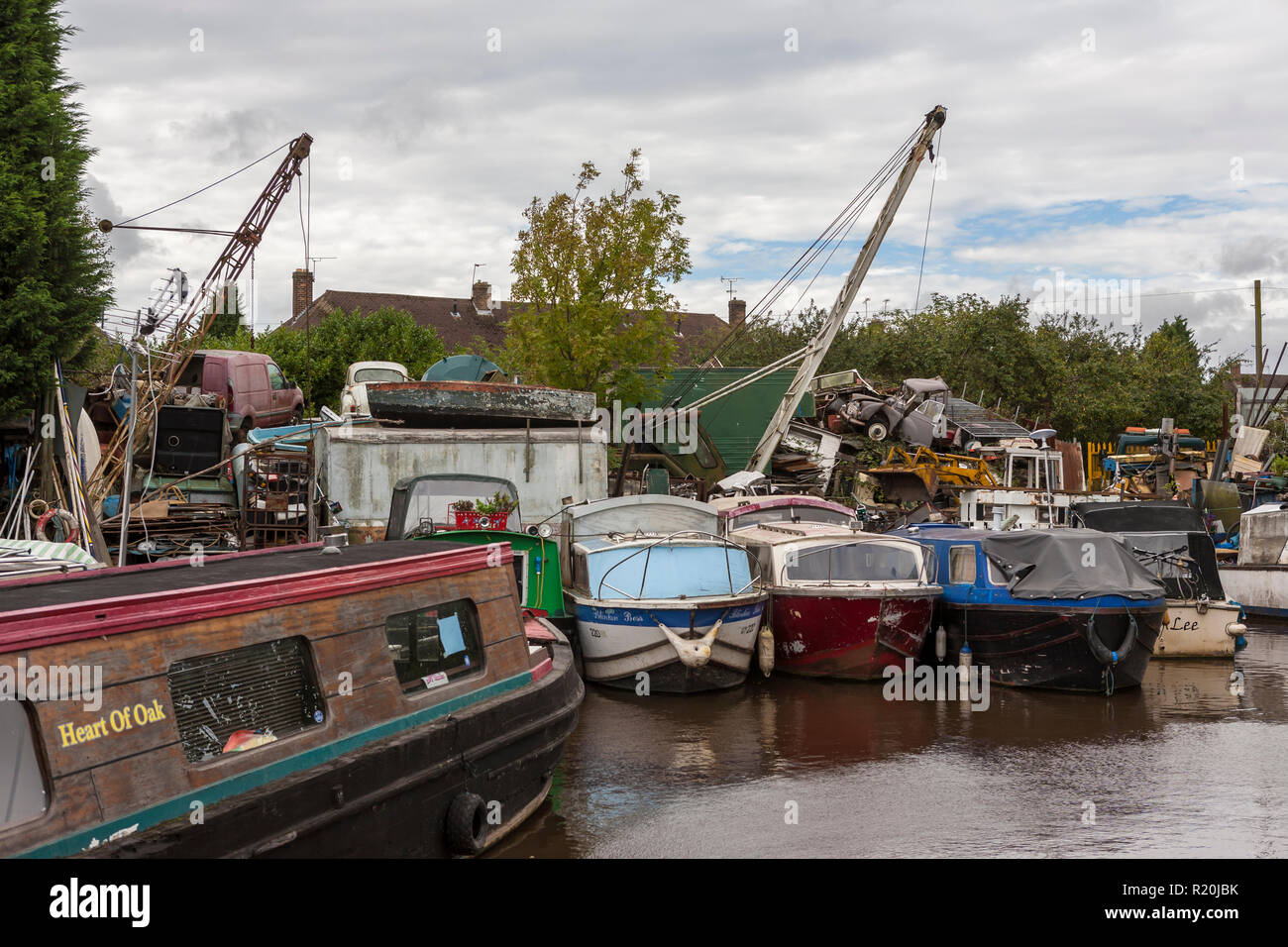 Scrapyard by the canal: Charity Dock on the Coventry Canal, Bedworth, Warwickshire, England, UK (WOP) Stock Photo