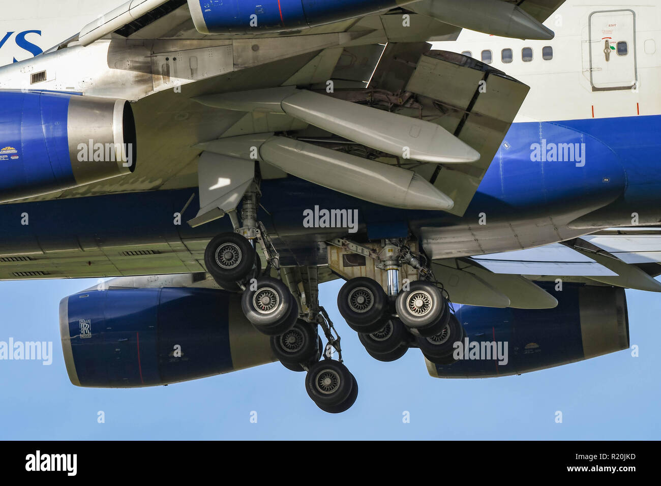 LONDON, ENGLAND - NOVEMBER 2018: Close up view of the wheels down and flaps down on a Boeing 747 'Jumbo jet' as it comes in to land at London Heathrow Stock Photo