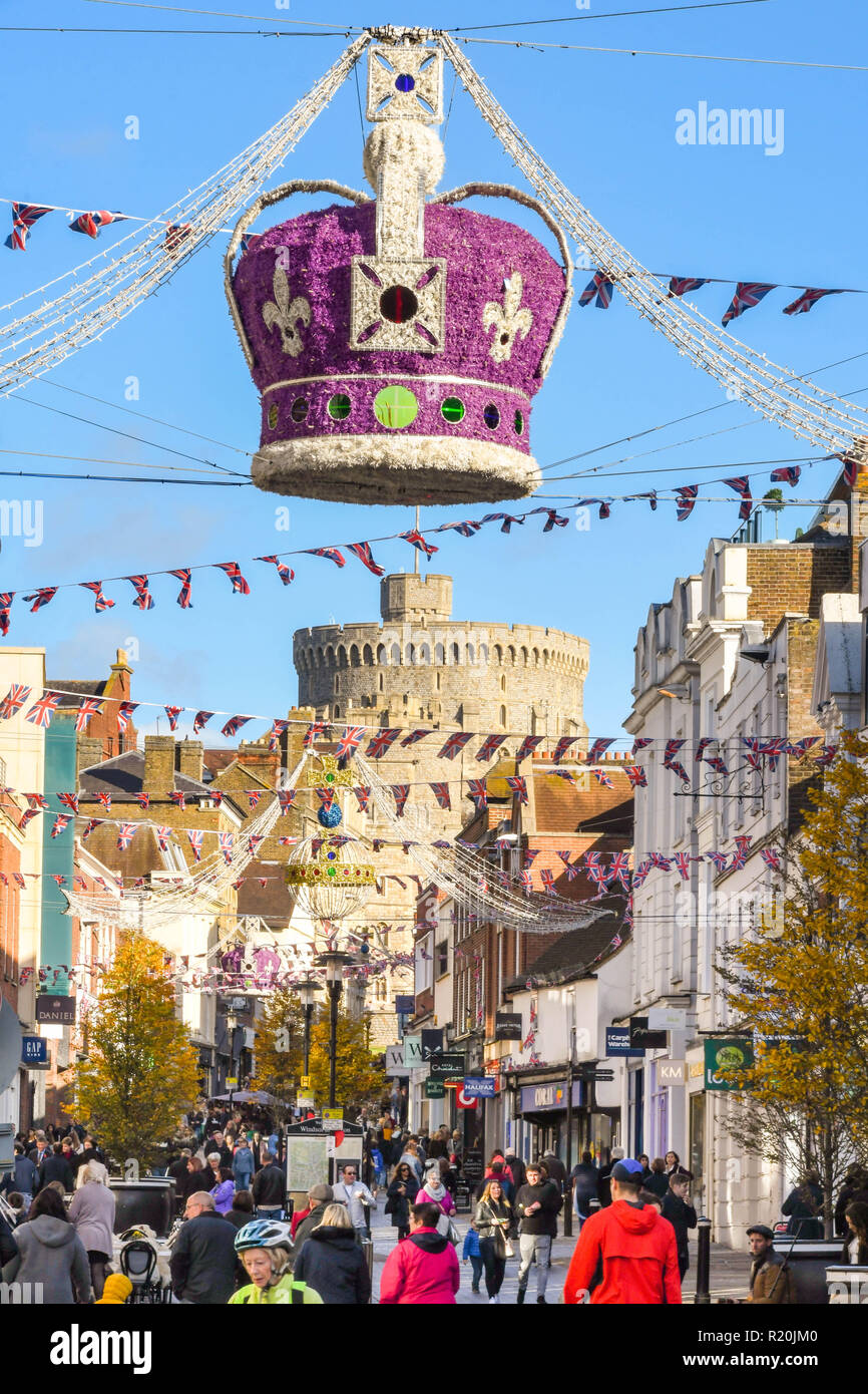 WINDSOR, ENGLAND - NOVEMBER 2018: Large regal crown suspended from wires over a street in Windsor town centre as part of its Christmas decorations. Wi Stock Photo