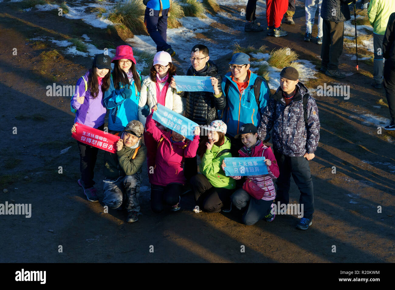 Group of Korean trekkers posing for a picture on the summit of Poon Hill, Annapurna region, Nepal. Stock Photo