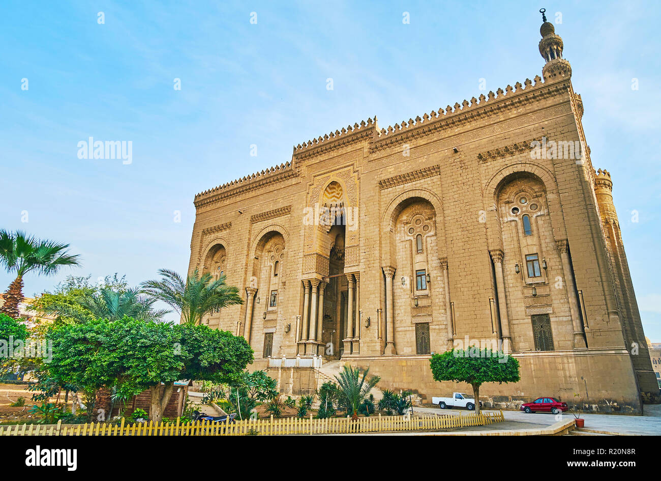 The monumental building of historic Al-rifai Mosque with slender pillars, stone carvings and tall scenc portal (iwan), Cairo, Egypt. Stock Photo