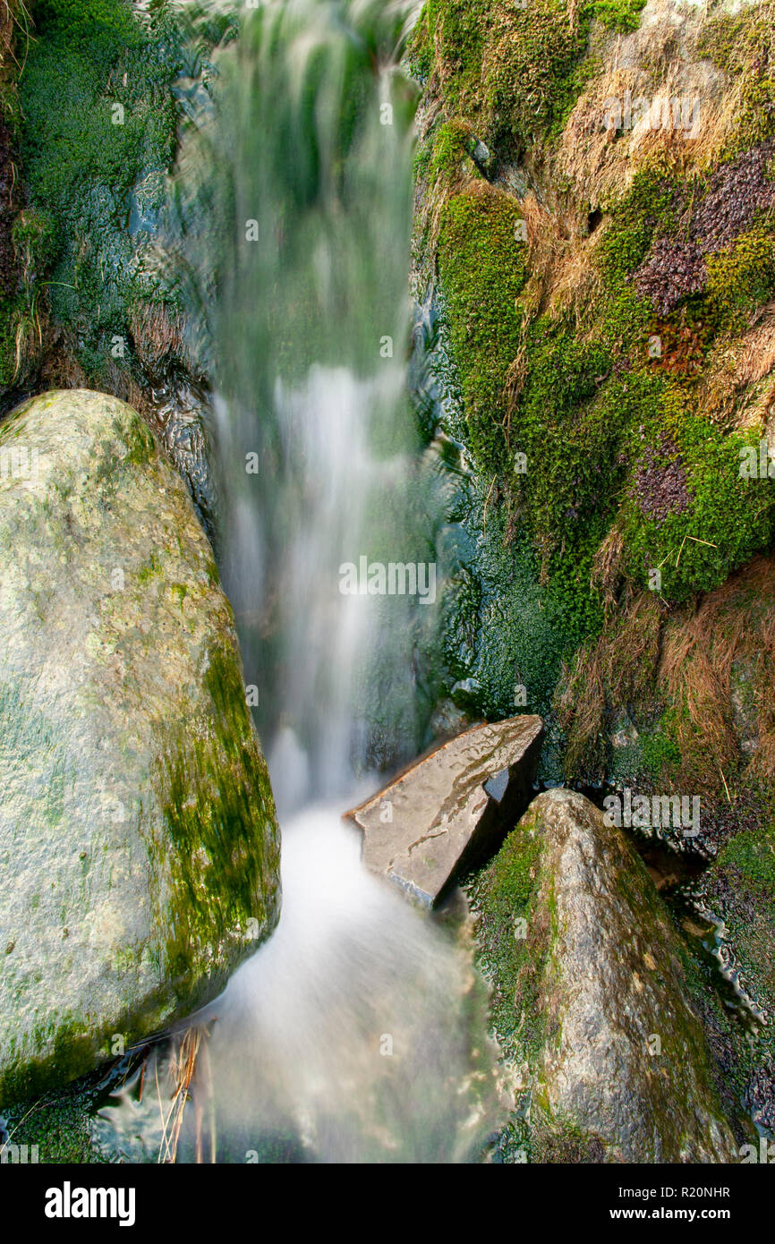 Small waterfall in a rocky stream in Snowdonia, North Wales Stock Photo