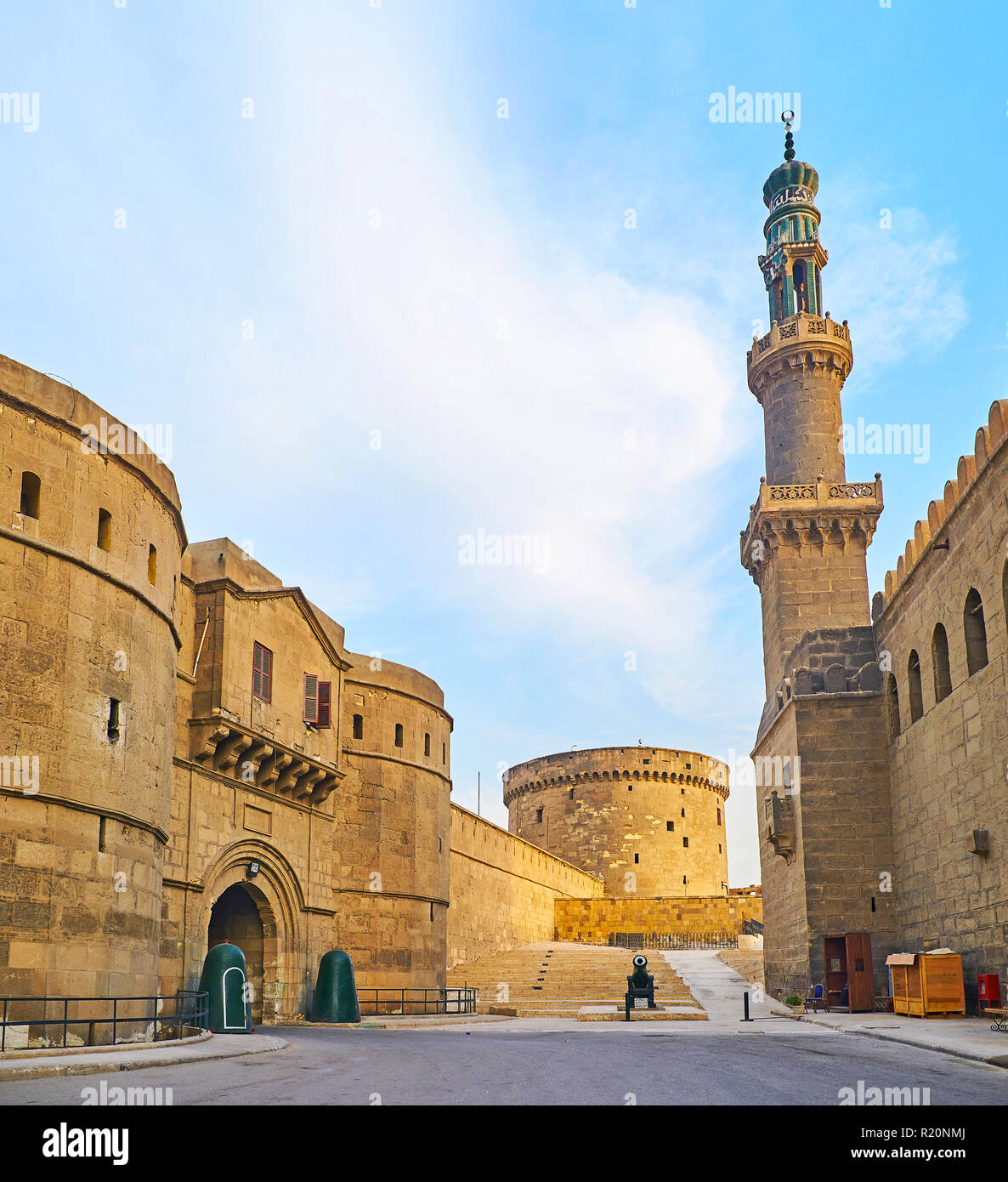 The entrance gate of Military Museum of Saladin Citadel neighbors with the tall carved minaret of Al-Nasir Muhammad Mosque, Cairo, Egypt. Stock Photo