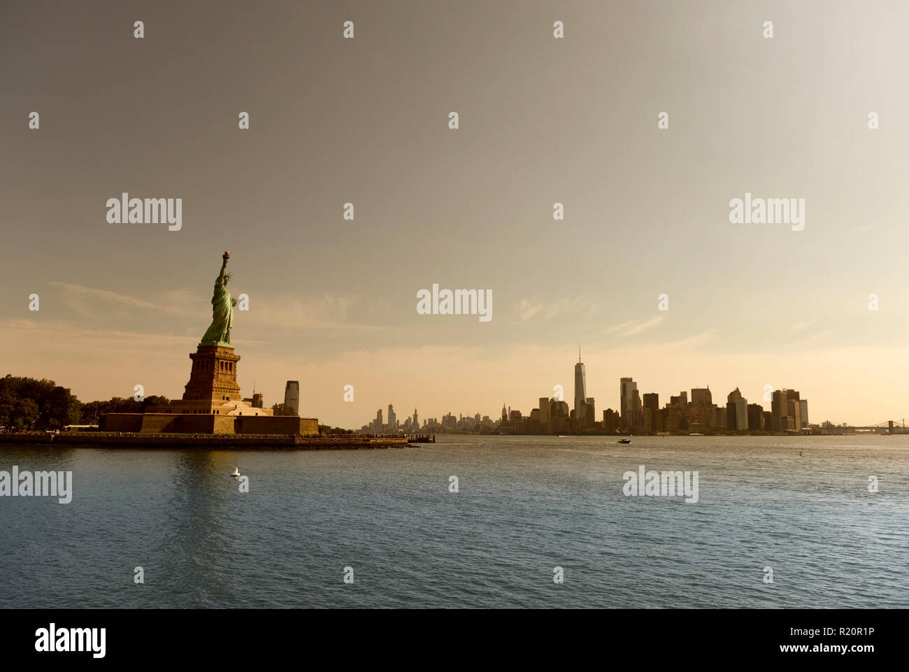 Statue of Liberty and financial district in lower Manhattan, New York City, NY, USA. Stock Photo