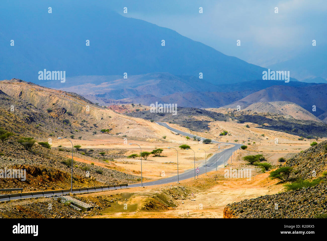 Colorful landscape and road to Wadi Dayqah Dam. Muscat, Oman. Stock Photo
