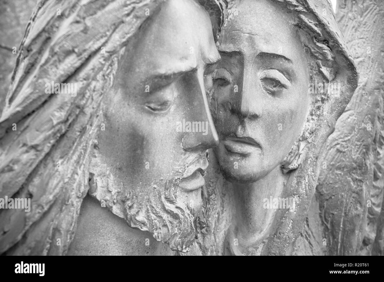 Bas-relief in bronze representing The Pity of Michelangelo. Faces of Holy Mary mother and Jesus Christ after the Crucifixion. Stock Photo