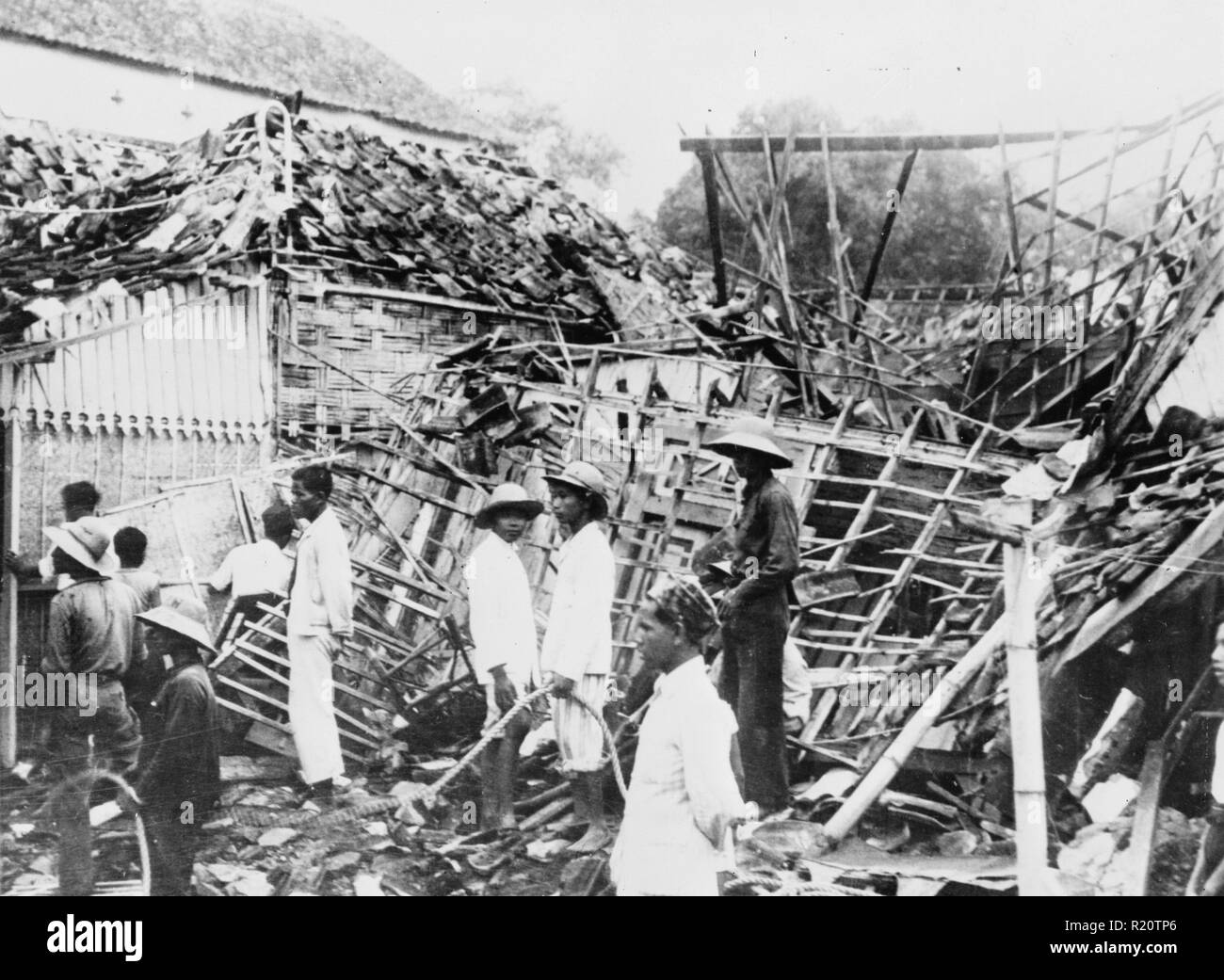 Photograph of a house in the native quarter wrecked by a Japanese bomb during an air raid. Dated 1942 Stock Photo