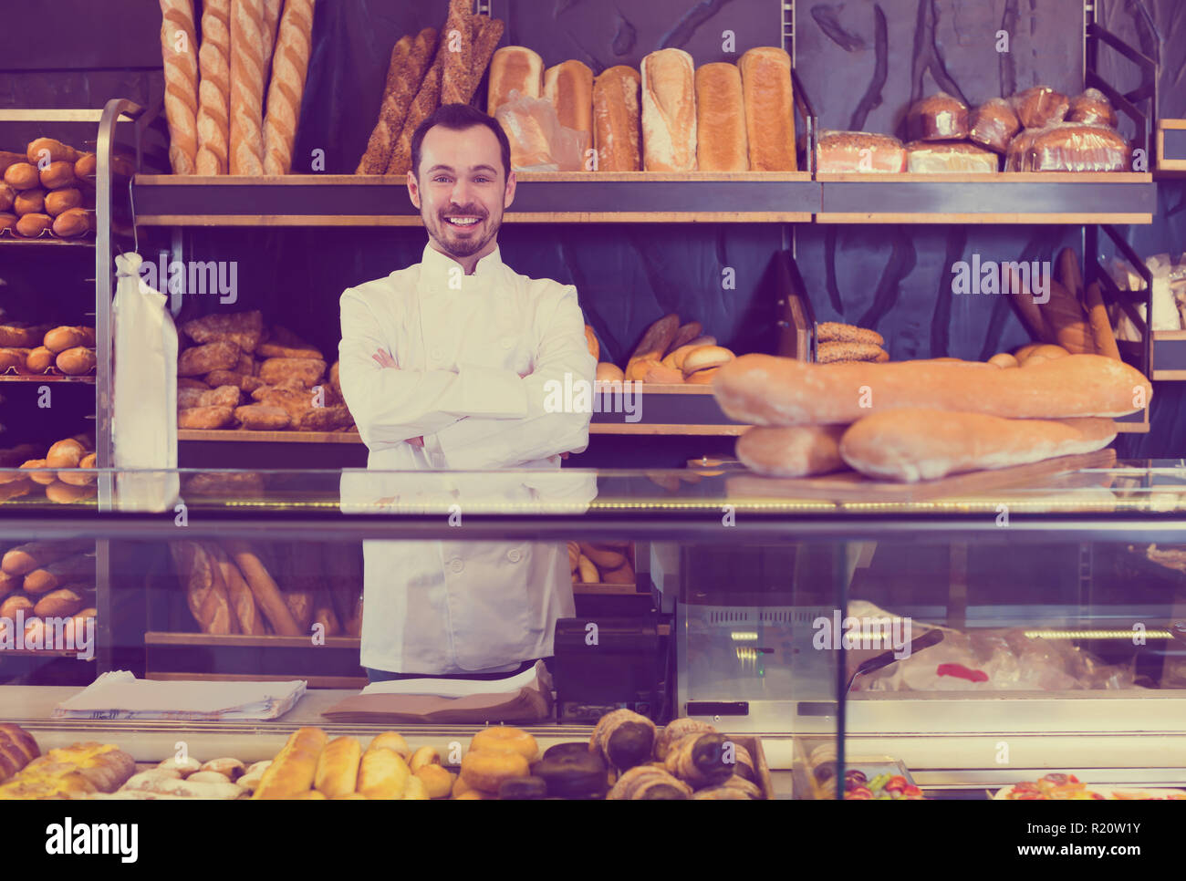 Young male pastry maker demonstrating pastry in bakery Stock Photo Alamy