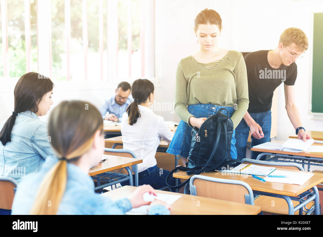 Girls and boys are preparing for lecture in the classroom Stock Photo ...