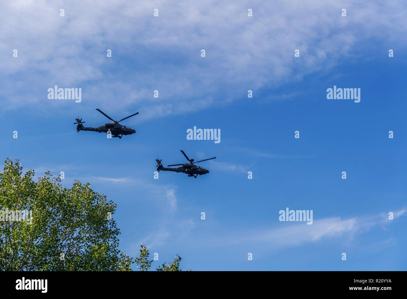 Greek Air Force Apache helicopters flying.  2 Boeing AH-64 attack helicopters flying at 28 October military parade. Stock Photo
