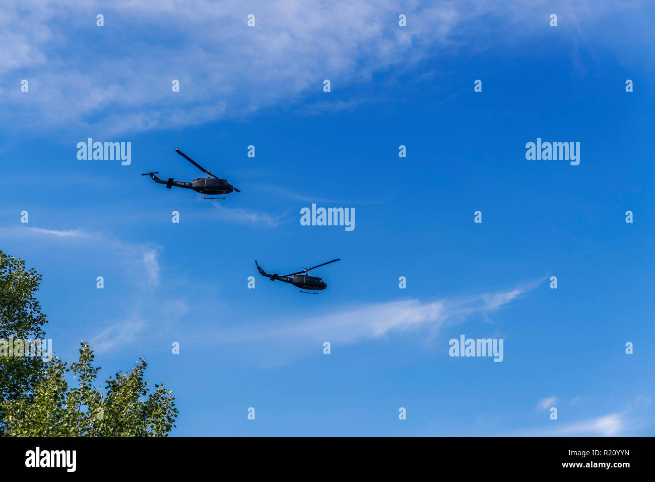 Greek Air Force Bell Huey helicopters flying. Hellenic Army Aviation UH-1H Agusta-Bell AB-205A at Thessaloniki military parade. Stock Photo