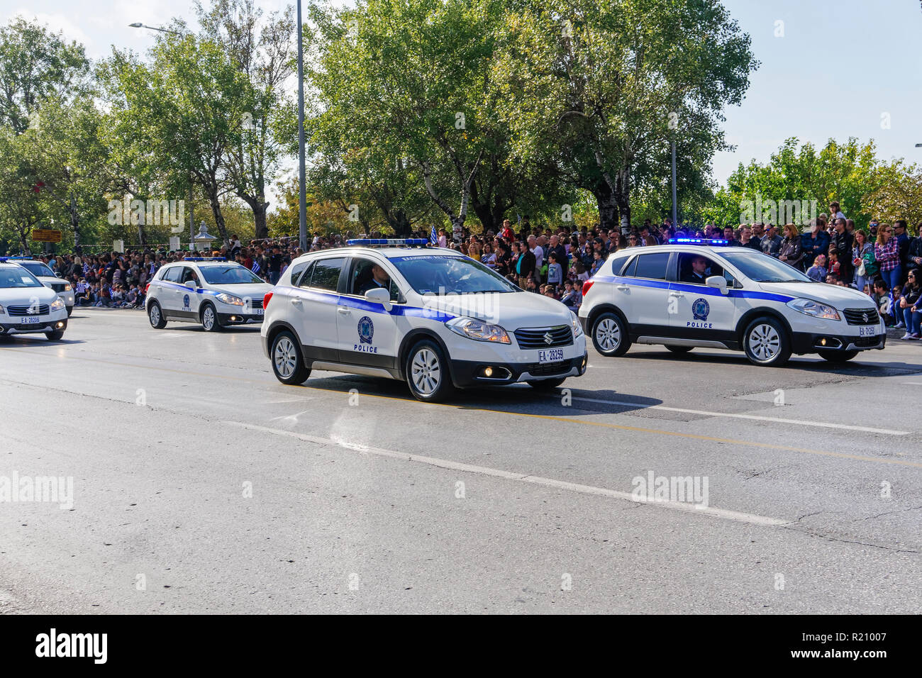Hellenic Police cars during Oxi Day parade in Thessaloniki, Greece. Greek police - Ellinikii Astynomia Security forces vehicles with personnel. Stock Photo