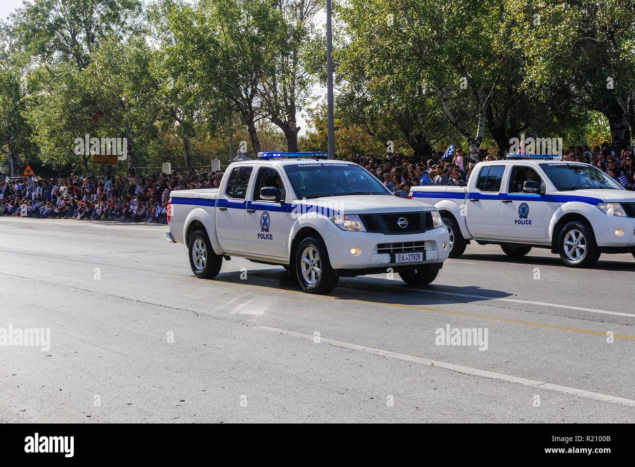 Hellenic Police Pick up cars during Oxi Day parade in Thessaloniki, Greece. Greek police - Ellinikii Astynomia Security forces trucks with personnel. Stock Photo