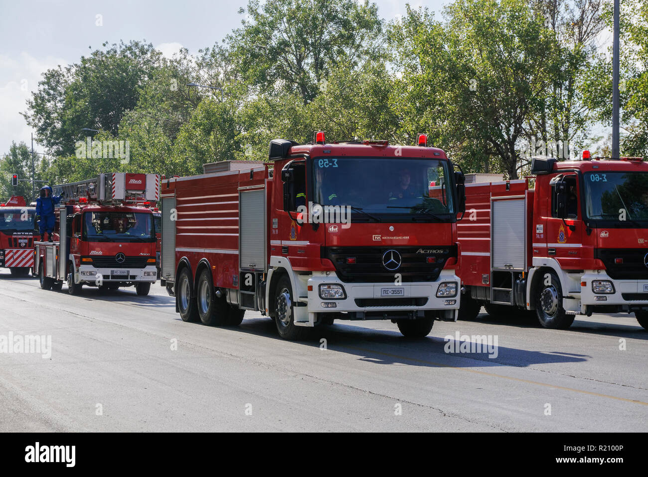 Greek Fire Service trucks during Oxi Day parade in Thessaloniki, Greece. Hellenic Fire Brigade vehicles with Greek firefighters in uniform. Stock Photo