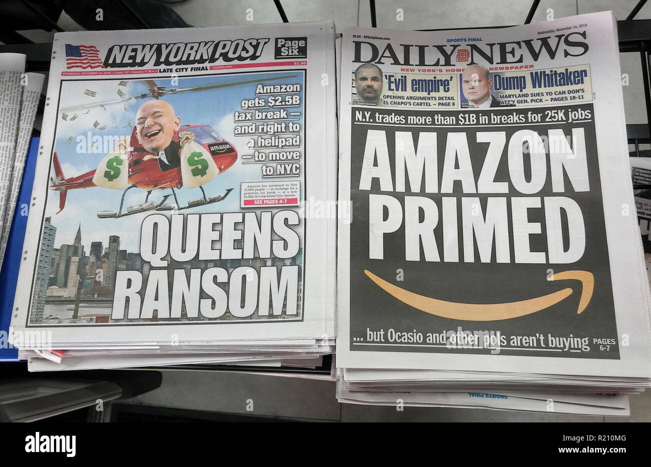 Headlines of New York newspapers report on Wednesday, November 14, 2018 about the decision by Amazon to place half of its HQ2 in the Long Island City neighborhood in New York. (© Richard B. Levine) Stock Photo