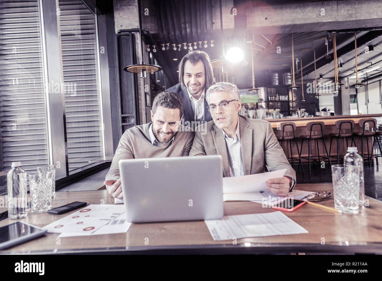 Positive delighted office workers having online conference Stock Photo